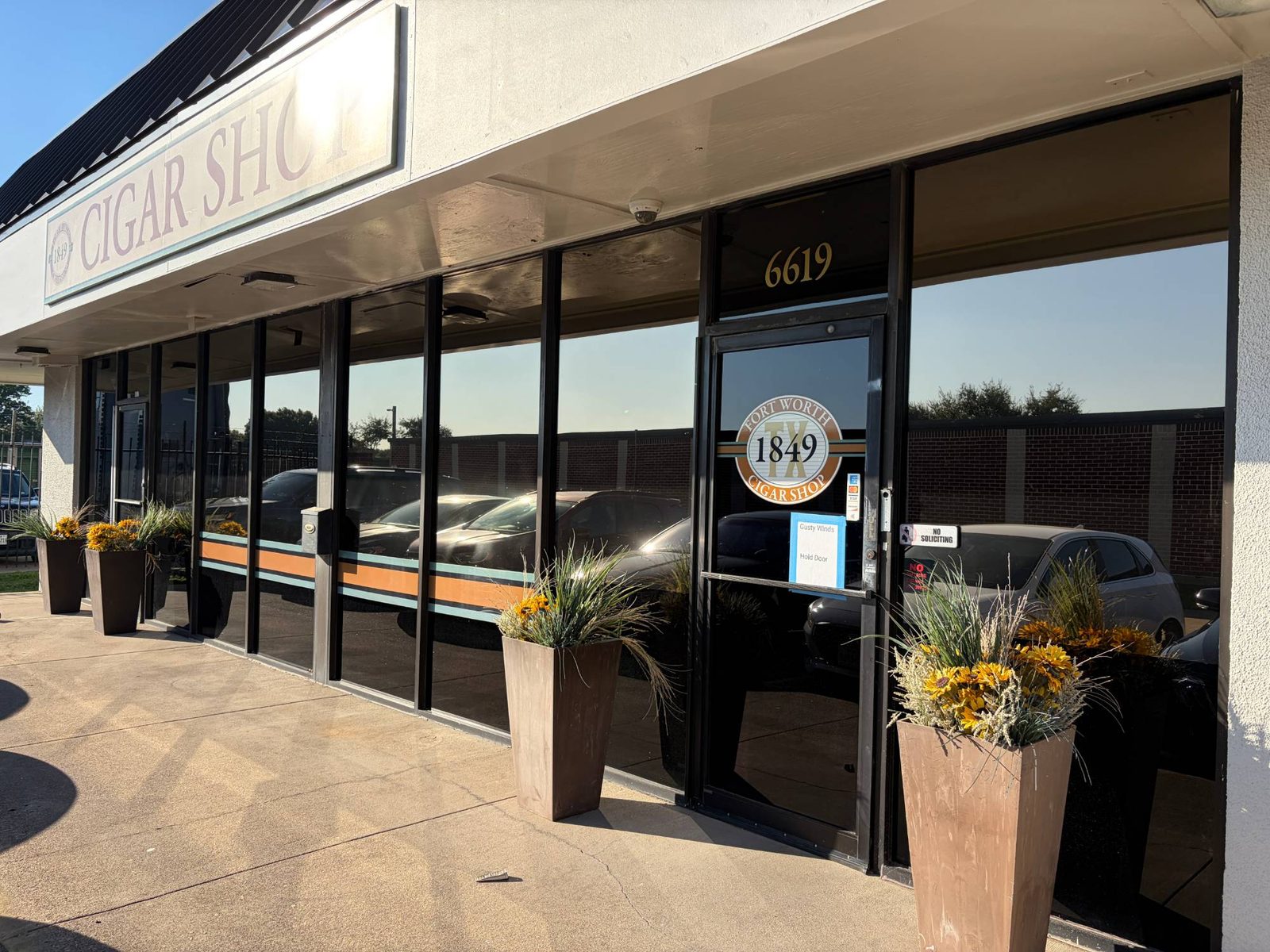 Cigar shop storefront in Fort Worth after commercial window tint install